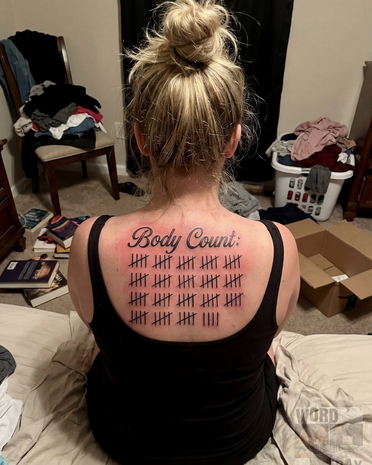 7 Back Tattoo Writing Ideas for Lettering That Lasts 3 A person's upper back featuring a large tattoo of the words Body Count followed by tally marks.