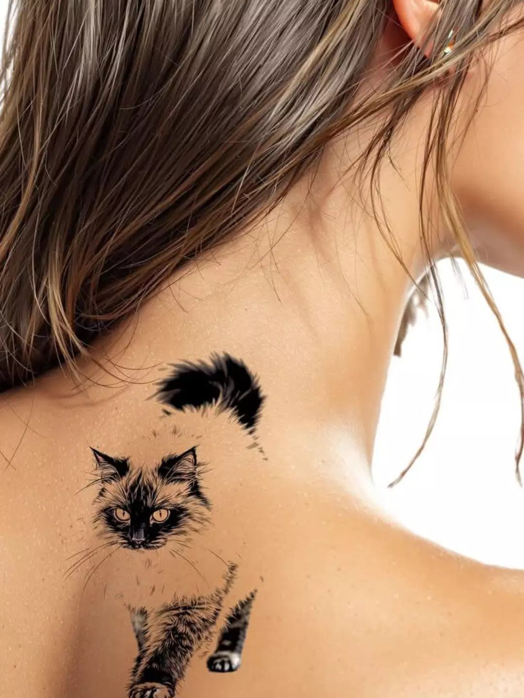 Black and grey realistic cat tattoo with a curved tail on a person's neck.